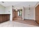 Bright foyer with hardwood floors, a stylish chandelier, and a view into the living area at 5101 Estates Cir, Sarasota, FL 34243