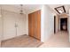 Bright foyer featuring a front door, closet, and view to the kitchen at 5101 Estates Cir, Sarasota, FL 34243