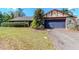 Cozy one story home with a two-car garage and mature landscaping at 5101 Estates Cir, Sarasota, FL 34243