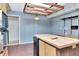 Kitchen features classic oak cabinets, an island, and double oven perfect for cooking at 5101 Estates Cir, Sarasota, FL 34243