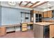 Kitchen features classic oak cabinets, an island, and double oven perfect for cooking at 5101 Estates Cir, Sarasota, FL 34243