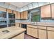 Kitchen features classic oak cabinets, an island, and double oven perfect for cooking at 5101 Estates Cir, Sarasota, FL 34243