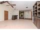 Open floor plan showcasing the living room with tile flooring and built ins at 5101 Estates Cir, Sarasota, FL 34243