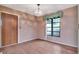 Bright living room with hardwood floors, a window, and a doorway into another room at 5101 Estates Cir, Sarasota, FL 34243