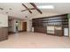 Living room featuring a ceiling fan, skylight, and built in shelving at 5101 Estates Cir, Sarasota, FL 34243