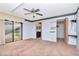 Bright primary bedroom with a sliding glass door, ensuite bath access, and walk-in closet at 5101 Estates Cir, Sarasota, FL 34243