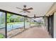Screened in patio features a concrete floor, ceiling fans, and views of the backyard at 5101 Estates Cir, Sarasota, FL 34243