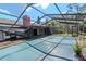 Enclosed screened-in pool area with a partially covered pool provides a refreshing and private outdoor retreat at 5101 Estates Cir, Sarasota, FL 34243