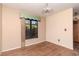 Room with a wood door, window with green accents and hard wood floors at 5101 Estates Cir, Sarasota, FL 34243