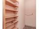 Functional storage room with sturdy wooden shelves for organized storage solutions at 5101 Estates Cir, Sarasota, FL 34243