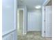 A carpeted hallway with closet and bedroom access. Great storage options available at 6262 Timberly Ln # 99, Zephyrhills, FL 33542