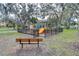 Community playground featuring slides, climbing structures, and a safe, enclosed area for children to play at 6262 Timberly Ln # 99, Zephyrhills, FL 33542