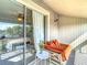 Cozy balcony with comfortable seating, sliding glass door and views that seamlessly blend indoor-outdoor living at 6317 Newtown Cir # 17B2, Tampa, FL 33615