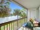 This balcony features a table, chairs and a wonderful view of the river at 6317 Newtown Cir # 17B2, Tampa, FL 33615