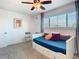 Bedroom featuring a daybed with trundle, ceiling fan, a large window, and a neutral palette at 6317 Newtown Cir # 17B2, Tampa, FL 33615