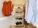 Organized walk-in closet with shelving and hanging storage, providing ample space for clothes and accessories at 6317 Newtown Cir # 17B2, Tampa, FL 33615