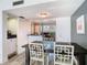 The dining room is spacious and features light walls, an ornate table set and opens to the kitchen at 6317 Newtown Cir # 17B2, Tampa, FL 33615