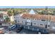 Exterior view of a condo complex with water views, private garages, and ample parking for residents at 6317 Newtown Cir # 17B2, Tampa, FL 33615
