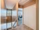 Upstairs hallway with view to bedroom featuring a trundle bed and neutral color scheme at 6317 Newtown Cir # 17B2, Tampa, FL 33615