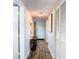 Inviting hallway with wood-look floors and a welcoming atmosphere at 6317 Newtown Cir # 17B2, Tampa, FL 33615