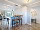 Breakfast bar seating in an open concept kitchen and living space at 6317 Newtown Cir # 17B2, Tampa, FL 33615