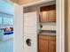 Convenient laundry closet with stacked washer/dryer and cabinet storage at 6317 Newtown Cir # 17B2, Tampa, FL 33615