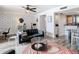 Inviting living room featuring modern furnishings, stylish wallpaper, and a cozy seating area at 6317 Newtown Cir # 17B2, Tampa, FL 33615