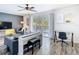 Relax in this living room complete with dark walls, white accents and a large sliding glass door at 6317 Newtown Cir # 17B2, Tampa, FL 33615