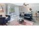 This living room features dark walls, white accents and a view into the patio at 6317 Newtown Cir # 17B2, Tampa, FL 33615