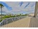 Wide view of the waterfront from the balcony, surrounded with sturdy white railings at 6467 Rubia Cir, Apollo Beach, FL 33572