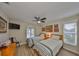 Inviting bedroom with twin beds, vibrant artwork, and a bright, airy feel at 6467 Rubia Cir, Apollo Beach, FL 33572