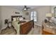 Comfortable bedroom with hardwood floors, ample natural light, and traditional furnishings at 6467 Rubia Cir, Apollo Beach, FL 33572
