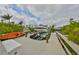 View of boat dock featuring a powerboat on a lift with kayak alongside, and canal beyond at 6467 Rubia Cir, Apollo Beach, FL 33572