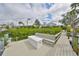 Waterfront view from a private dock with seating on the canal at 6467 Rubia Cir, Apollo Beach, FL 33572