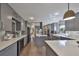 Modern kitchen with gray cabinets, stainless steel appliances, a large island, and sleek countertops at 6467 Rubia Cir, Apollo Beach, FL 33572
