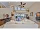 Inviting living room with vaulted ceilings, clerestory windows and access to the outdoor living space at 6467 Rubia Cir, Apollo Beach, FL 33572