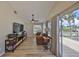 Bright living room with wood floors, comfortable seating, and sliding doors to the outside at 6467 Rubia Cir, Apollo Beach, FL 33572
