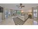 Spacious main bedroom with natural light, tile floors, and an elegant rug at 6467 Rubia Cir, Apollo Beach, FL 33572