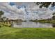Beautiful waterfront community with homes surrounding a scenic lake and fountain at 6467 Rubia Cir, Apollo Beach, FL 33572