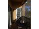 Cozy balcony with two wicker chairs, small table, and a view, perfect for relaxing outdoors at 6513 Sand Shore Ln, New Port Richey, FL 34652