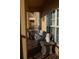 Relaxing balcony with a comfortable outdoor sofa, pillows, a small table, and a view to the outside at 6513 Sand Shore Ln, New Port Richey, FL 34652