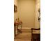 A charming entryway with a decorative table, chair, patriotic art, and neutral paint at 6513 Sand Shore Ln, New Port Richey, FL 34652