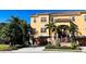Beautiful three story home with a tile roof, garage, manicured landscaping, and private entrance at 6513 Sand Shore Ln, New Port Richey, FL 34652