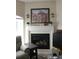 Comfortable seating near a fireplace with decorative mantle, plants and decorative wall sconces at 6513 Sand Shore Ln, New Port Richey, FL 34652