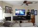 Cozy living room with modern TV, fireplace, neutral walls, and comfortable seating at 6513 Sand Shore Ln, New Port Richey, FL 34652