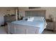 Comfortable main bedroom featuring a large bed, nightstands, and ample space for relaxation at 6513 Sand Shore Ln, New Port Richey, FL 34652