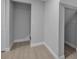 Finished basement with light wood-look floors and access to various rooms at 7 Georgia Ave, Crystal Beach, FL 34681