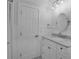 Bathroom featuring a marble vanity and decorative lighting at 7 Georgia Ave, Crystal Beach, FL 34681