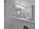 Bright bathroom showcasing walk-in shower, updated fixtures, and a large vanity mirror at 7 Georgia Ave, Crystal Beach, FL 34681