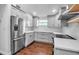 Modern kitchen featuring sleek countertops, stainless steel appliances, and ample cabinet space at 7 Georgia Ave, Crystal Beach, FL 34681